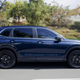 A photo of a blue Honda CR-V Hybrid taken in profile.